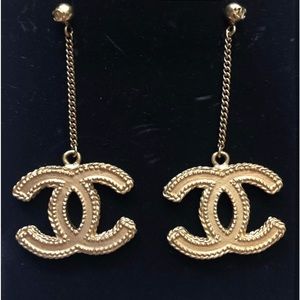 Authentic Chanel Matt gold dangle earrings in excellent condition.